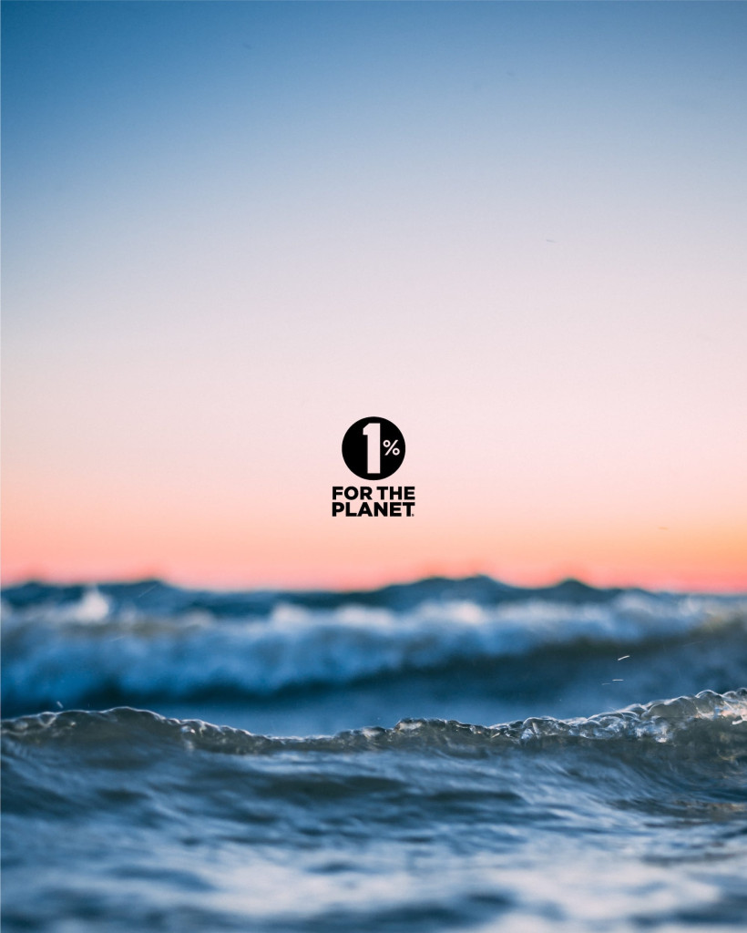 Waves in the ocean with a pastel sky at sunset; 1% FOR THE PLANET logo centered over the image.