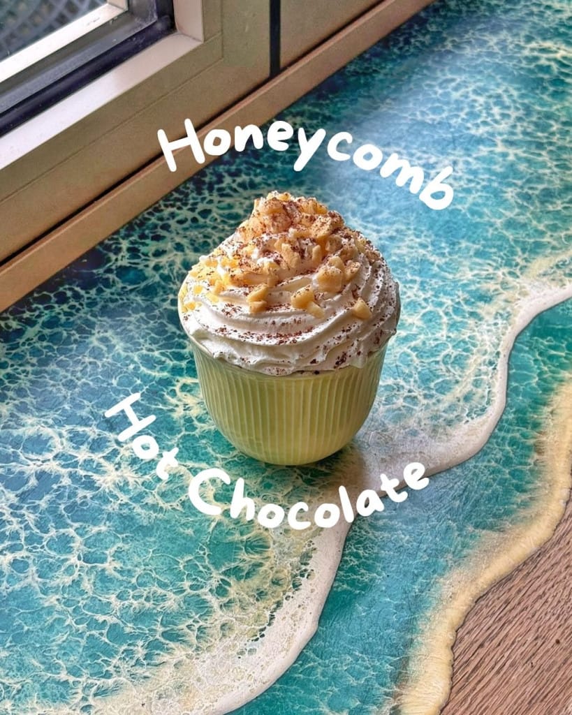 A honeycomb flavoured hot chocolate with whipped cream.