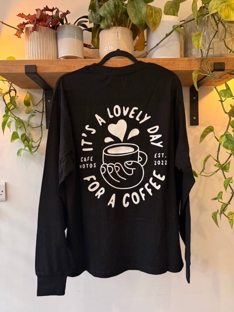 Black long sleeve "It's a lovely day for a coffee" merch t-shirt