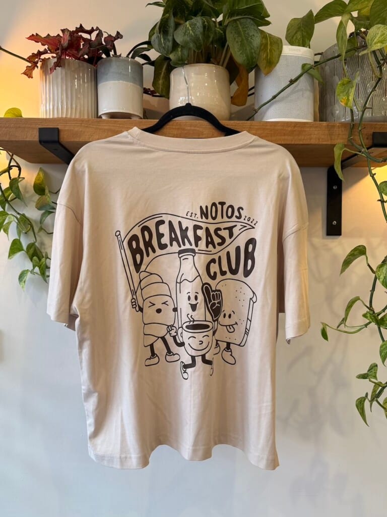 Off white short sleeve Notos breakfast club merch t-shirt