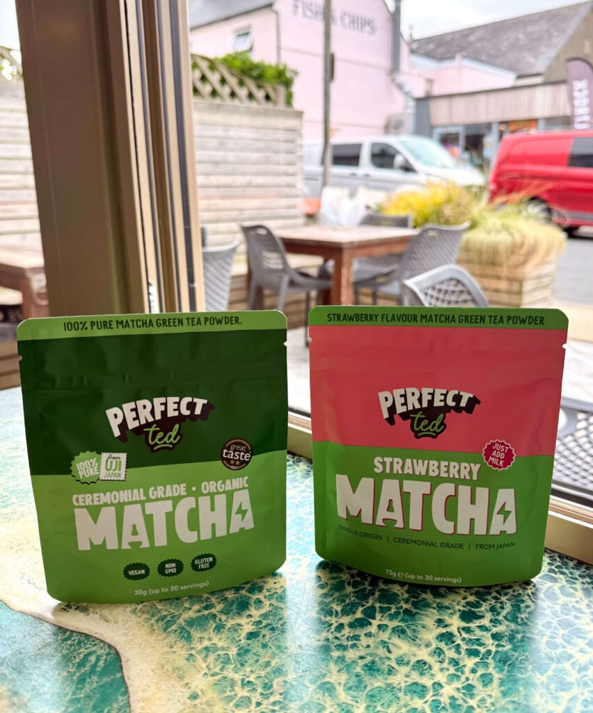 Two packs of Perfect Ted matcha powder on a window shelf.